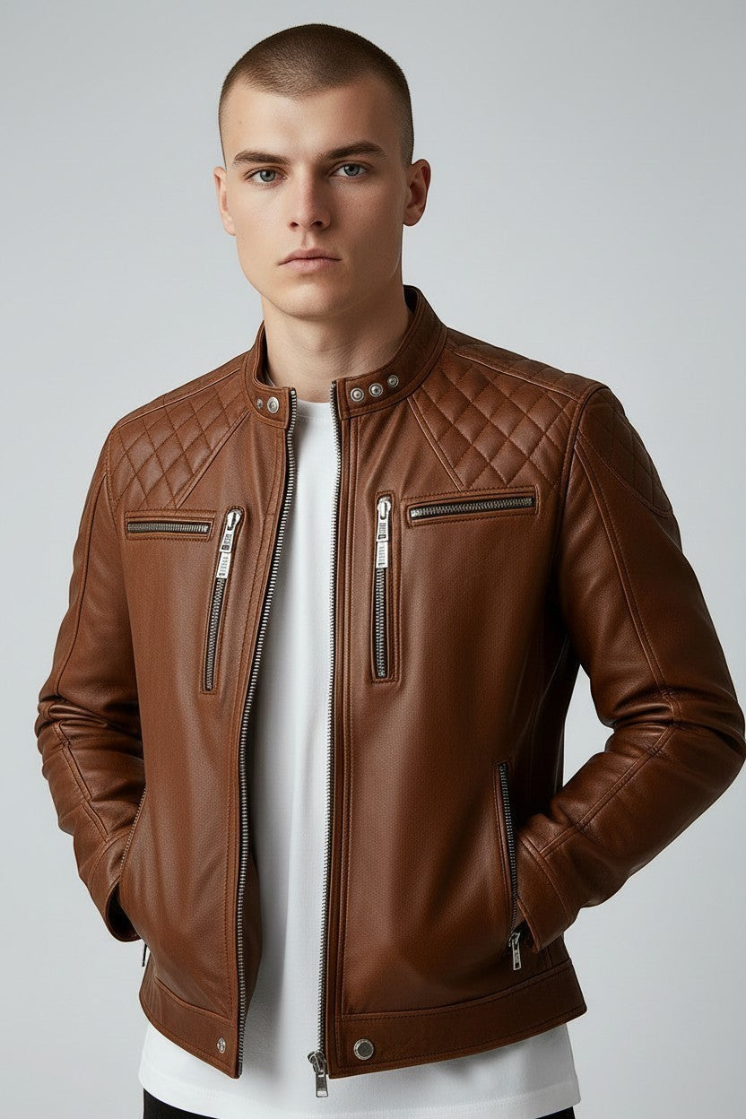 Scarlett Stitch men's tan leather biker jacket with quilted shoulders, mandarin collar, and silver-tone hardware.