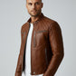 Scarlett Stitch men's tan leather biker jacket with quilted shoulders, mandarin collar, and silver-tone hardware.