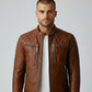 Scarlett Stitch men's tan leather biker jacket with quilted shoulders, mandarin collar, and silver-tone hardware.