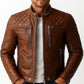 Scarlett Stitch men's tan leather biker jacket with quilted shoulder panels, mandarin collar, and silver zippers.
