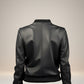 Scarlett Stitch Women's black faux leather bomber jacket with ribbed collar, cuffs, and hem.