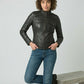 Scarlett Stitch Women's black faux leather moto jacket with zippered pockets and stand-up collar.