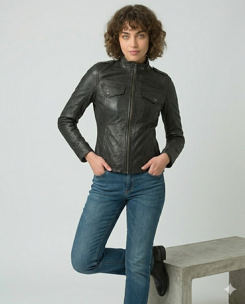 Scarlett Stitch Women's black faux leather moto jacket with zippered pockets and stand-up collar.