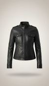 Scarlett Stitch Women's black faux leather moto jacket with stand-up collar, epaulets, zippered pockets, and cuffs.