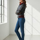 Scarlett Stitch women's black leather bomber jacket with red ribbed collar, cuffs, and hem. Full zip, zippered pockets.