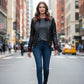 Scarlett Stitch women's black leather bomber jacket with red ribbed accents on collar, cuffs, and hem. Full zip front.