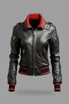 Scarlett Stitch Women's black leather bomber jacket with red ribbed collar, cuffs, and hem. Zip front, zippered pockets.