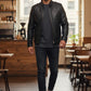 Scarlett Stitch men's black faux leather bomber jacket with stand collar and zippered pockets.