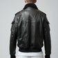 Scarlett Stitch men's black leather bomber jacket with faux fur collar, ribbed cuffs, and multiple pockets.