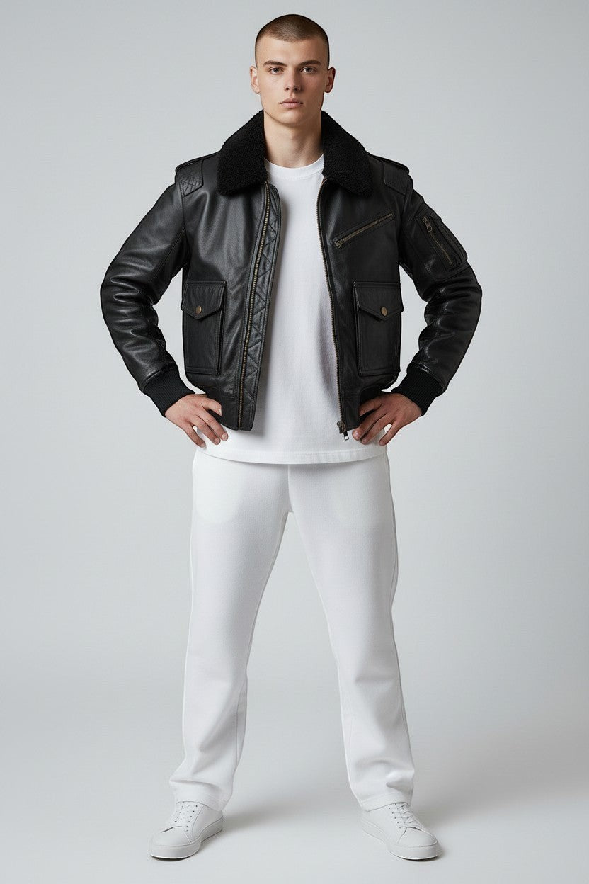 Scarlett Stitch men's black leather bomber jacket with faux fur collar, ribbed cuffs, and multiple pockets.