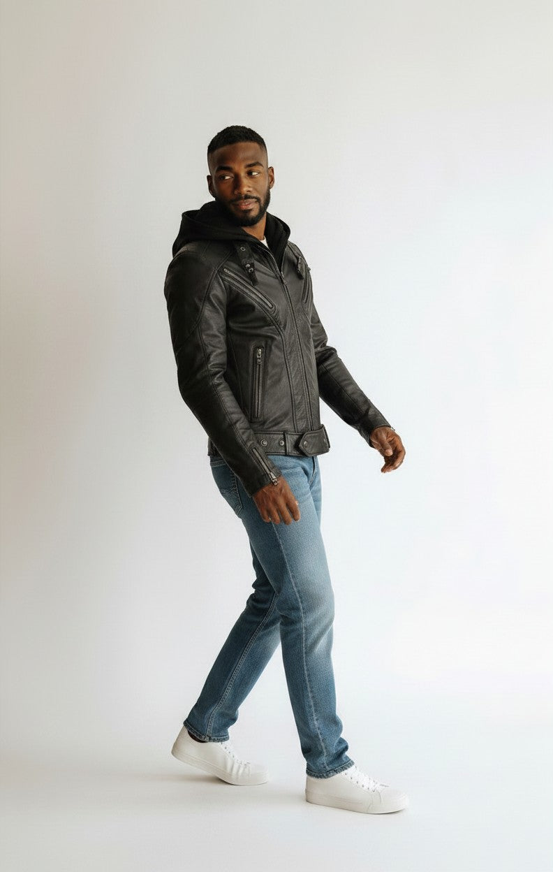 Scarlett Stitch black leather hooded jacket with zipper details and zippered cuffs, worn by a man in blue jeans.