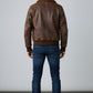 Scarlett Stitch Men's distressed brown faux leather bomber jacket with sherpa collar, ribbed cuffs and hem.