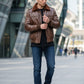 Scarlett Stitch brown faux leather bomber jacket with shearling collar, ribbed cuffs and hem, worn by a man.