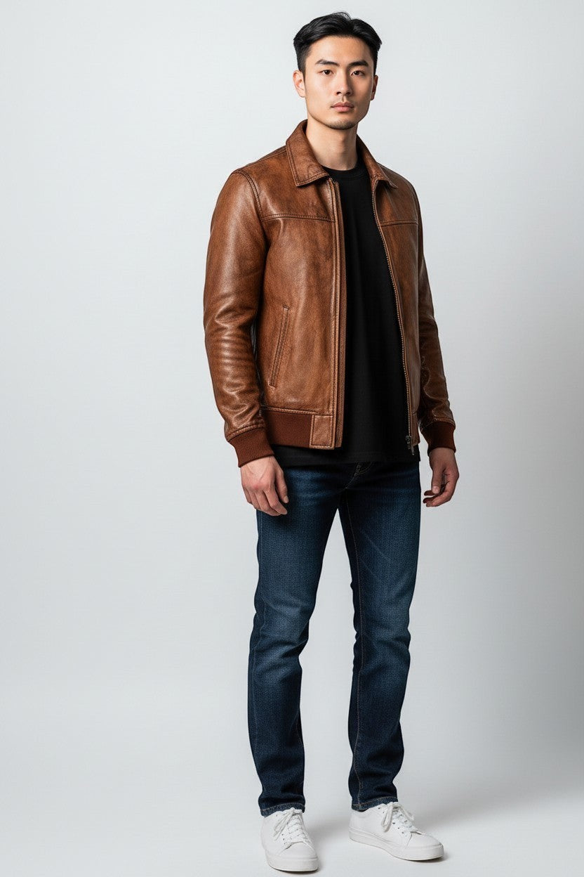 Scarlett Stitch Men's vintage distressed brown genuine leather bomber jacket with ribbed collar, cuffs, and hem.