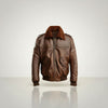 Scarlett Stitch men's brown genuine leather bomber jacket with detachable faux shearling collar, ribbed cuffs and hem, and zippered pockets.