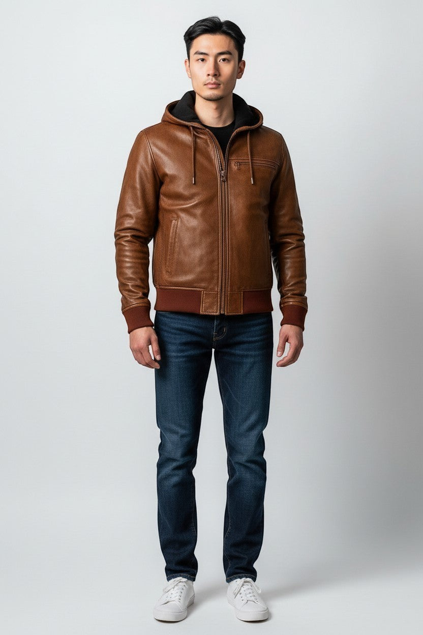 Scarlett Stitch men's distressed brown leather bomber jacket with attached hood, ribbed cuffs and hem, and zip-up front.